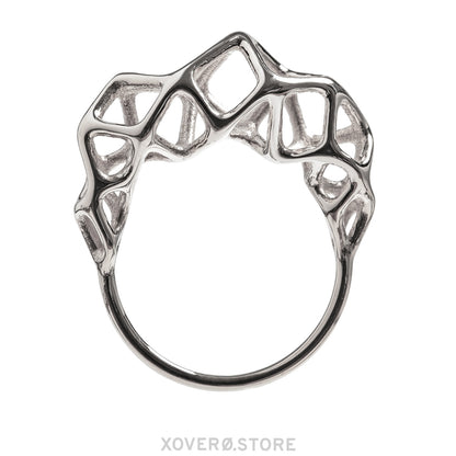 A sterling silver ring with a geometric, cage-like design at the crown of a delicate band. 