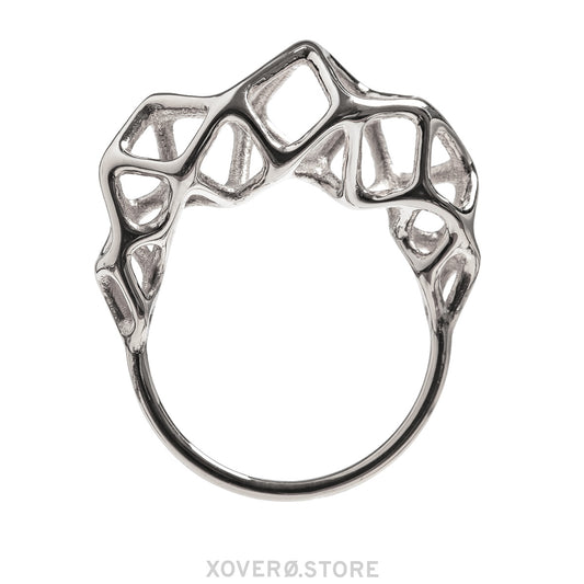 A sterling silver ring with a geometric, cage-like design at the crown of a delicate band. 