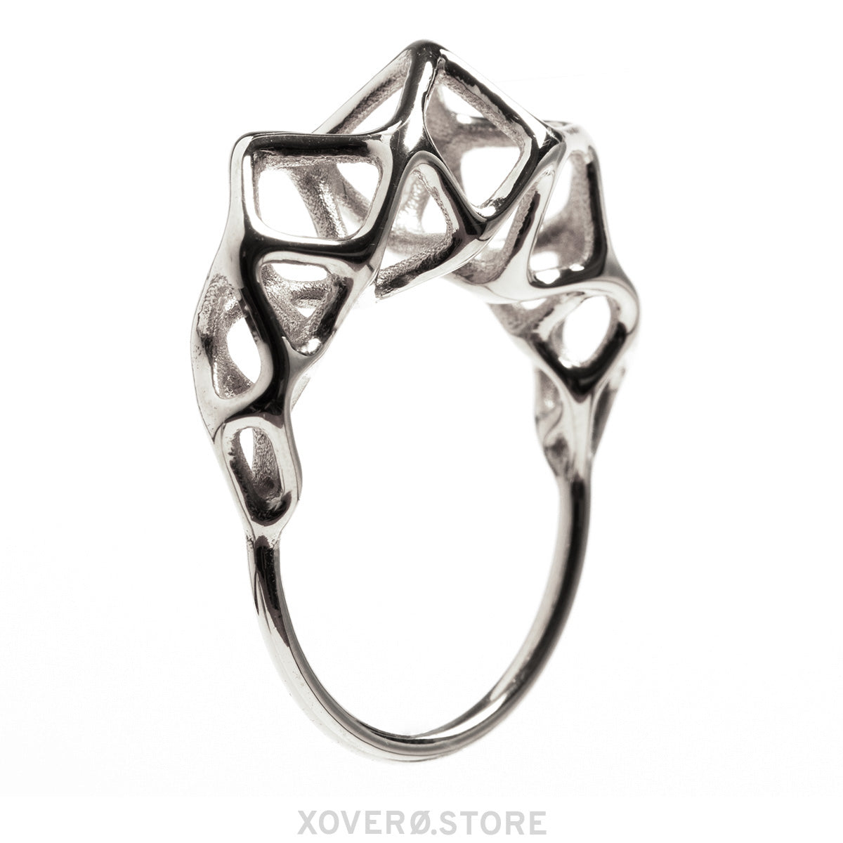 Side view of a dimensional sterling silver ring with geometric latticework crown. 