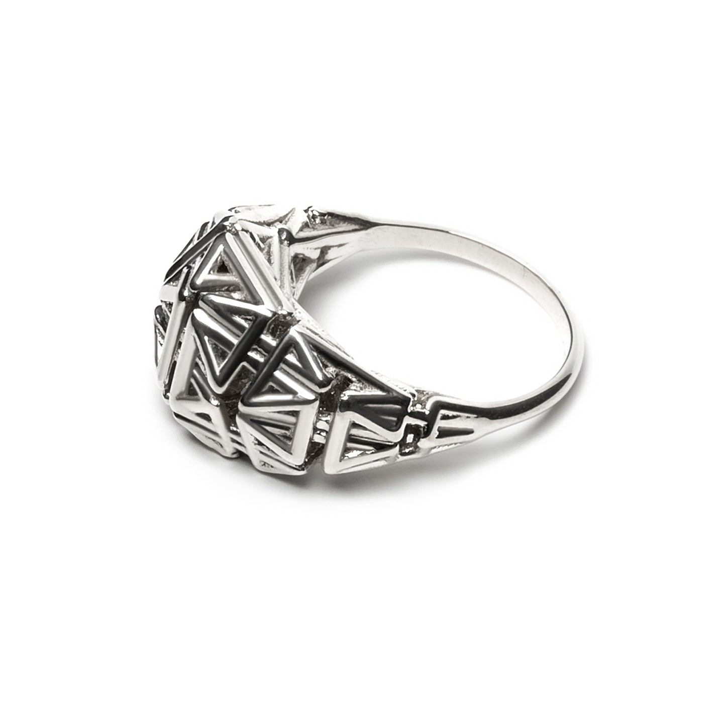 Side view of a sterling silver ring with a crown of angular latticework springing from a narrow band.