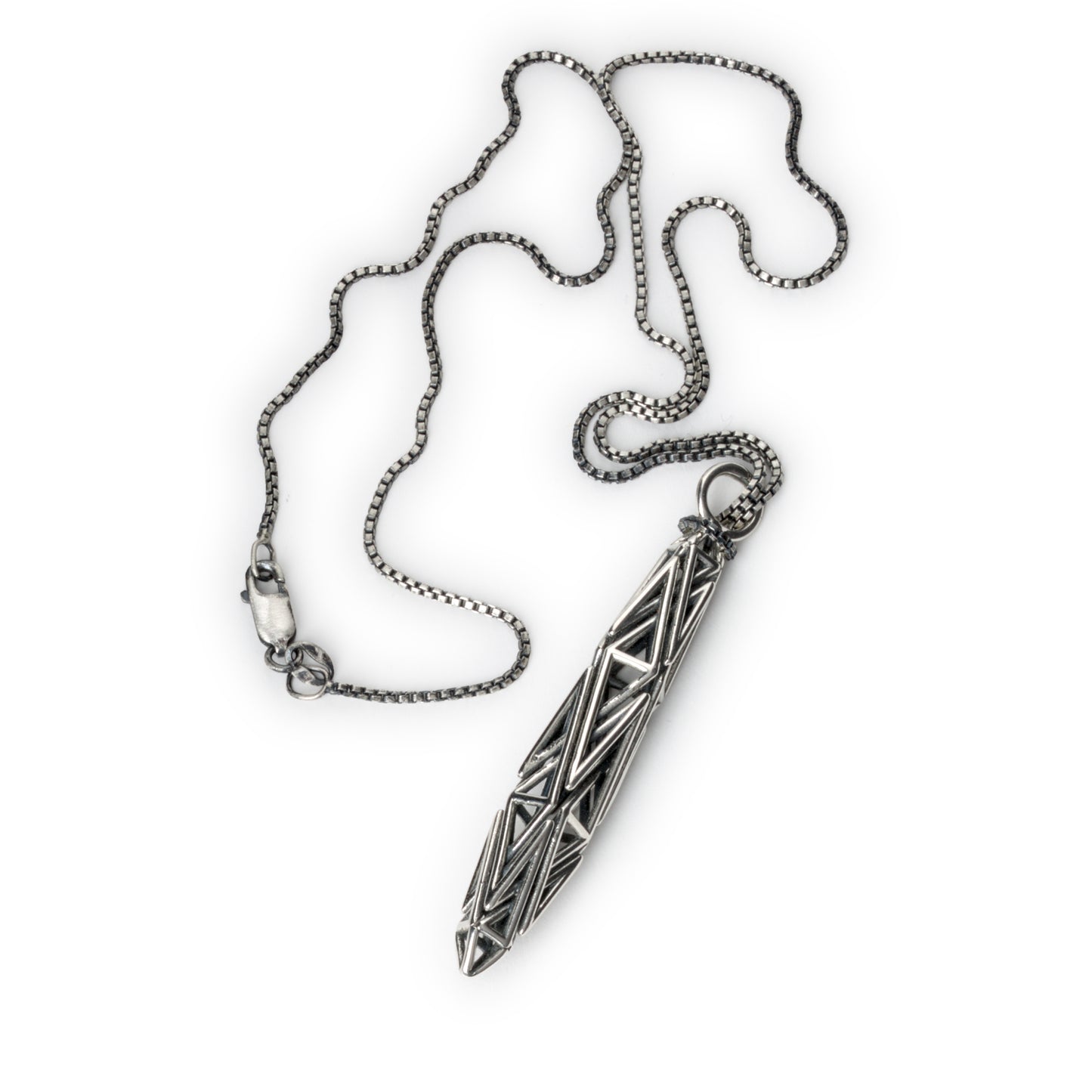 Solid sterling silver necklace with a sculptural geometric spire pendant of interwoven angles, on an 18-inch box chain with lobster clasp.