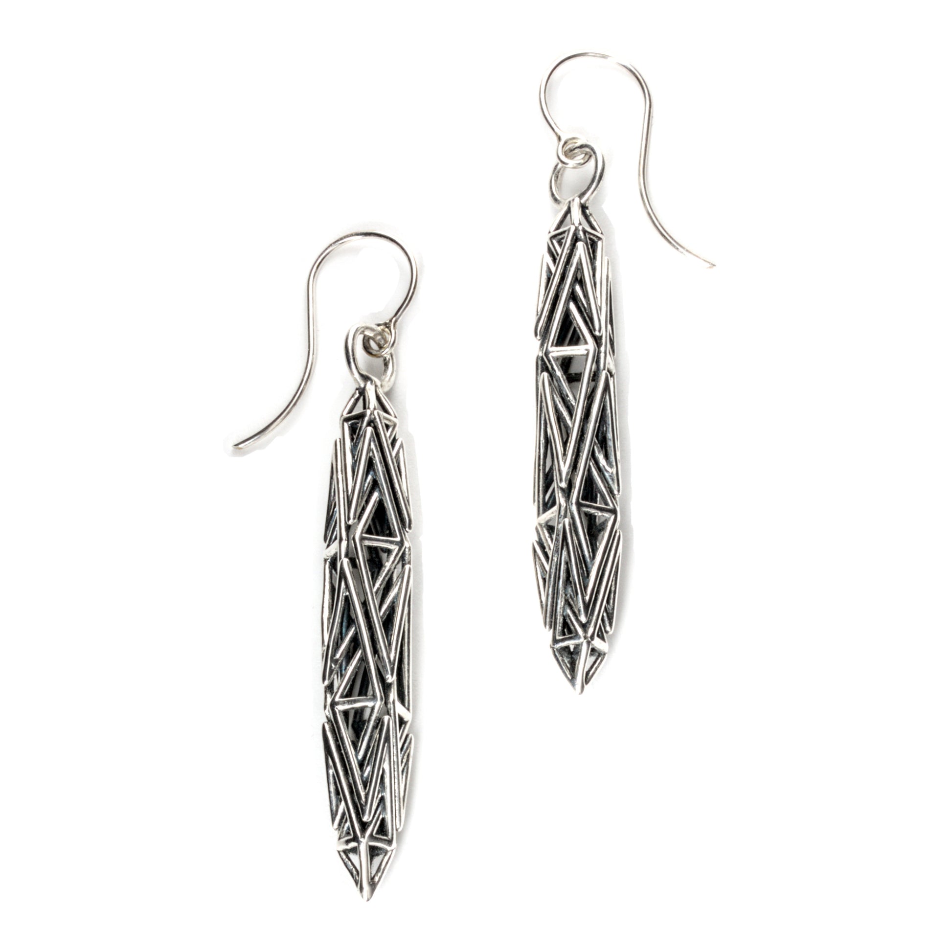 Sculptural solid sterling silver dangle earrings with angular prismatic latticework, crafted for lovers of architectural, edgy artisan jewelry.