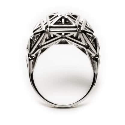Sculptural unisex ring in solid .925 sterling silver with oxidized recesses and angular architectural latticework in a signet-like form.