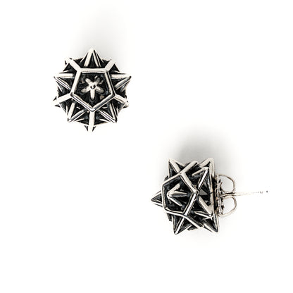 The contrast oxidized version of our solid sterling "Morningstar" earrings is shown here. Blackening the recessed areas of the design help the interlocking geometries pop. Each protruding spike is polished to a mirror finish. The star shapes seen at certain angles of the design are emphasized. 