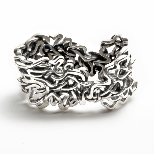 Seven ancient courses of the Mississippi River are woven together in this solid sterling silver heirloom napkin ring. 