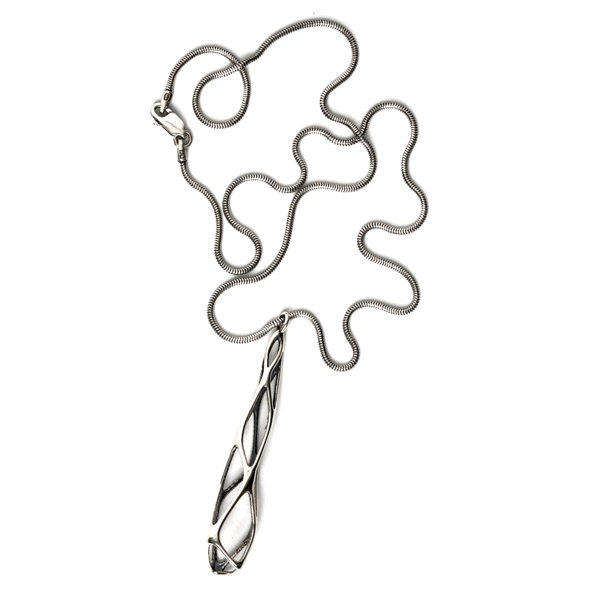 Solid sterling silver architectural pendant necklace with edgy elongated lattice suspended from a snake chain and secured with a lobster clasp. Contrast oxidation adds darkness and depth to recessed details. 