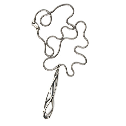Solid sterling silver architectural pendant necklace with edgy elongated lattice suspended from a snake chain and secured with a lobster clasp. Contrast oxidation adds darkness and depth to recessed details. 