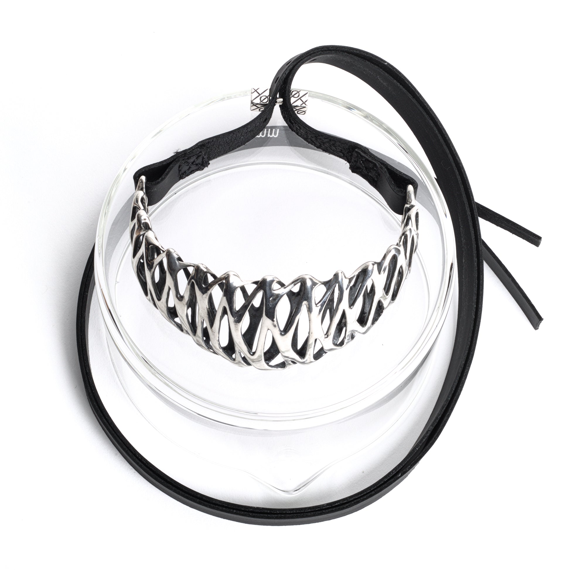 A solid .925 sterling silver tall high necked choker necklace with long black leather straps and a embossed cube-ended bar clasp. Crafted from heirloom quality materials. Adjustable fit and style. 
