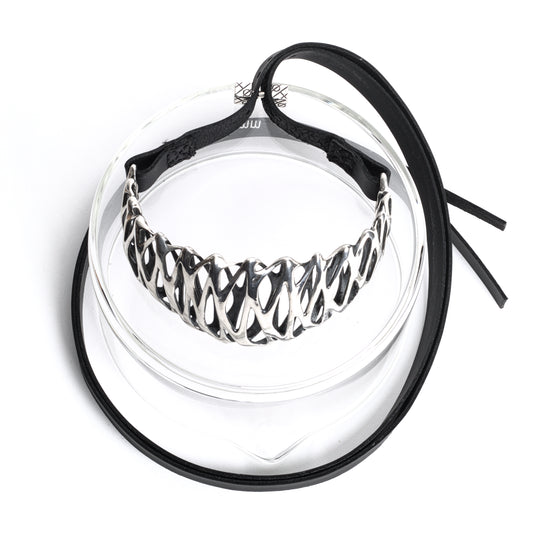 A solid .925 sterling silver tall high necked choker necklace with long black leather straps and a embossed cube-ended bar clasp. Crafted from heirloom quality materials. Adjustable fit and style. 