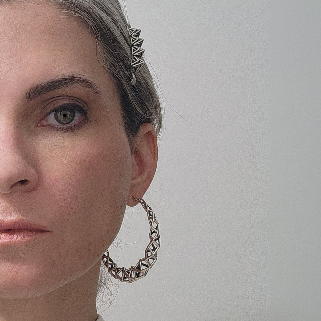 Chunky sterling silver latticework hoop earring is styled on a woman wearing Xover0s solid sterling silver bobby pin. All hand soldered and cast in small batches in our tiny rural studio. We are a factory free operation. 