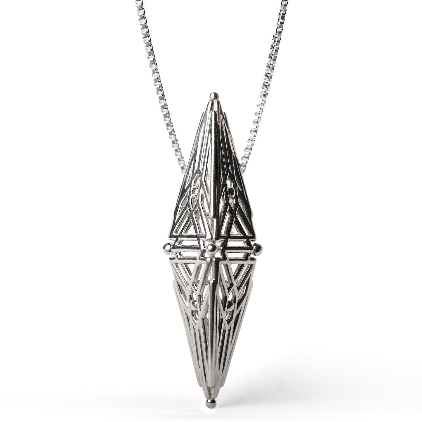Sterling silver architectural pendant with symmetric Art Deco inspired geometry suspended from a box chain. 
