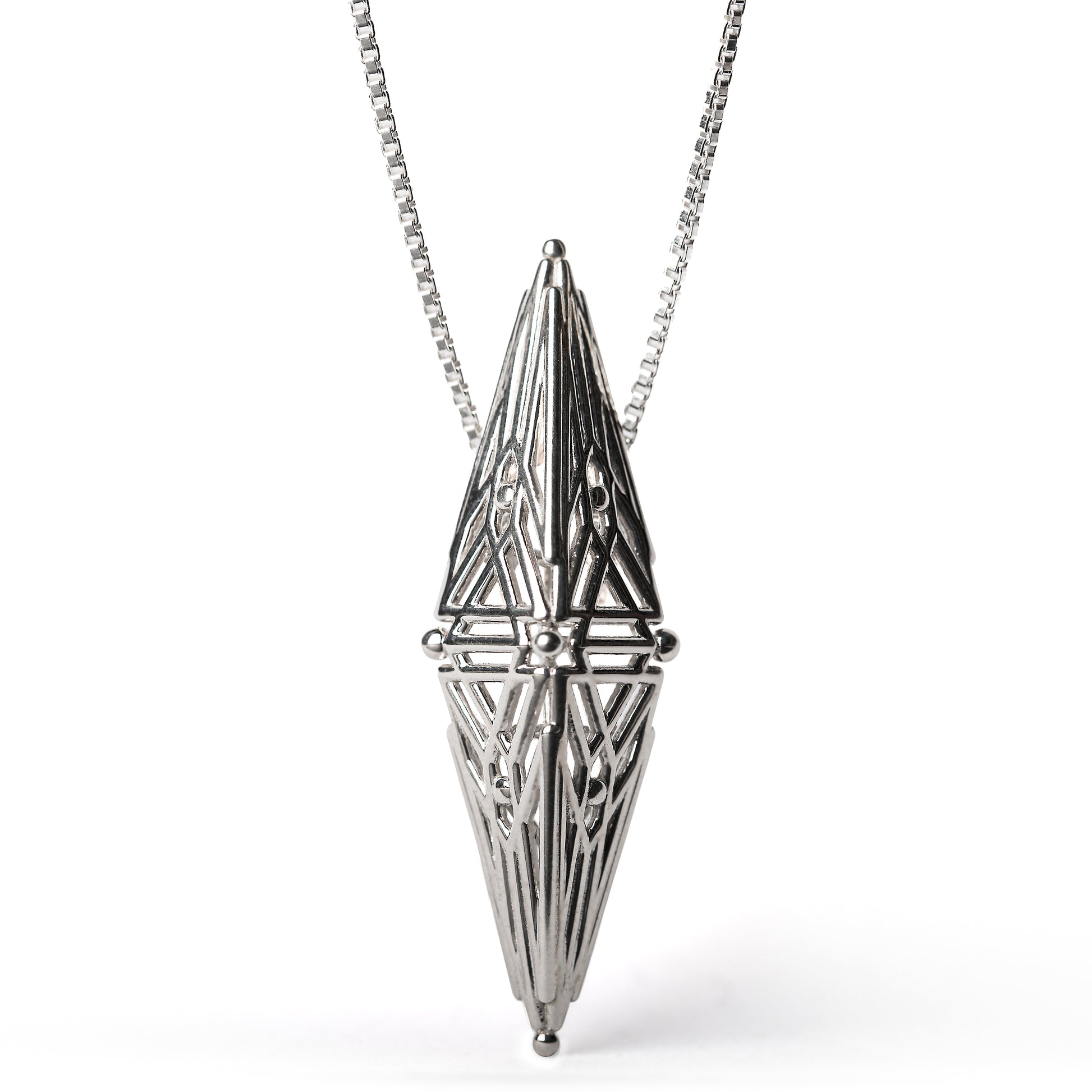 Sterling silver architectural pendant with symmetric Art Deco inspired geometry suspended from a box chain. 