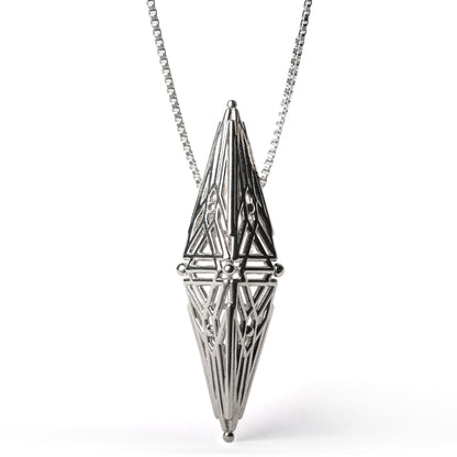 Sterling silver architectural pendant with symmetric Art Deco inspired geometry suspended from a box chain. 