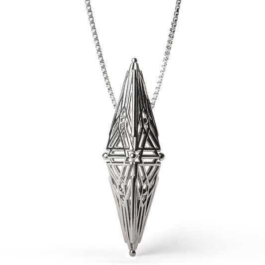 Sterling silver architectural pendant with symmetric Art Deco inspired geometry suspended from a box chain. 