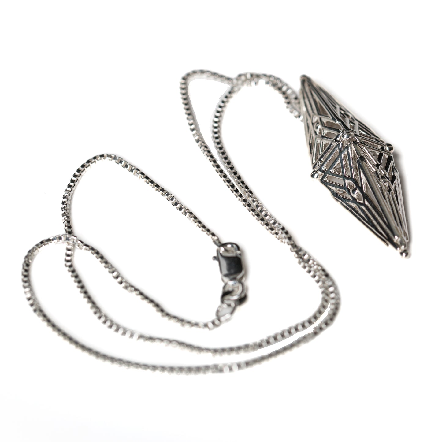 Sterling silver lattice pendant with angular Art Deco inspired geometry on an 18 inch box chain secured with a lobster clasp. 