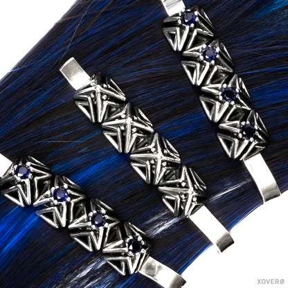 Xover0's Art Deco- inspired solid sterling silver and sapphire heirloom bobby pins clipped to a strand of blue hair. 