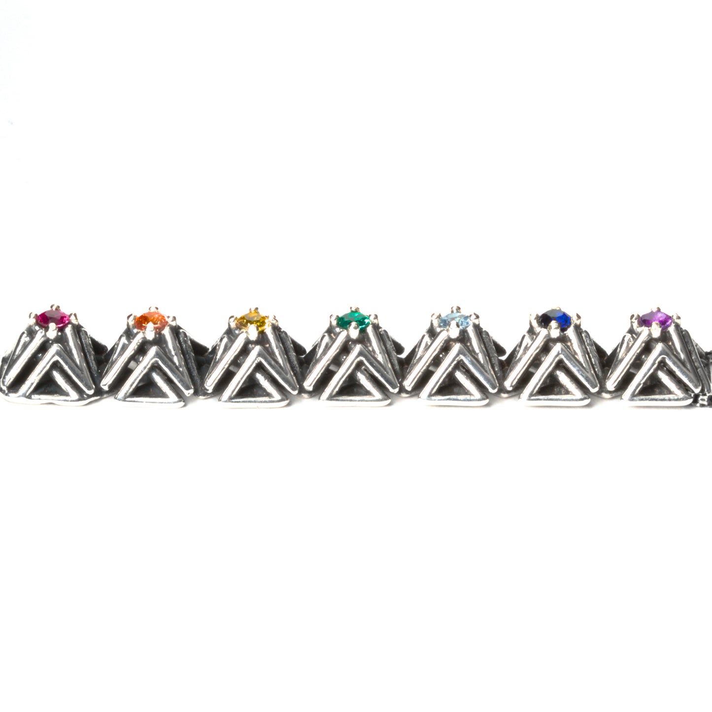 Side view of the solid .925 bar pendant with rainbow gemstones. This photo shows the dimension of the complex stud settings. Each pyramid spike measures about 1x1x1  cm. 