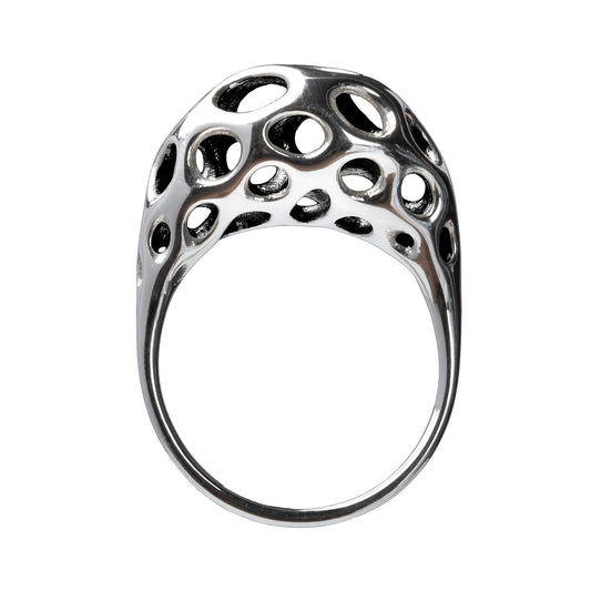 A sterling silver ring with a sculptural, crescent-shaped dome featuring intricate oval cutouts, displayed against a white background.