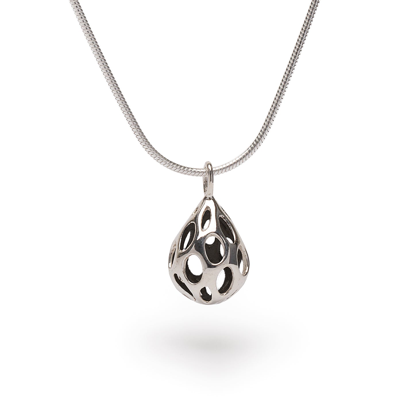 Polished sterling silver OLEA pendant necklace by Xover0, featuring a dimensional teardrop shape pierced with oval cutouts. Suspended from an 18-inch liquid silver snake chain, this minimalist, raindrop-inspired design reflects light with every movement.
