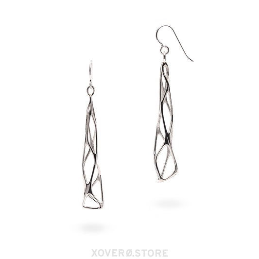 A pair of sterling silver earrings with a geometric, spire-like design, suspended from hand soldered hooks.