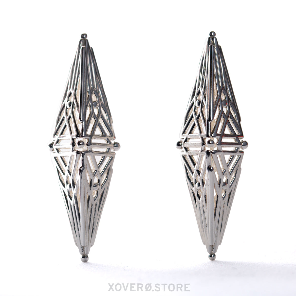 These sterling silver earrings echo Art Deco latticework with their delicately articulating angular forms in a mesmerizing symmetric pattern.