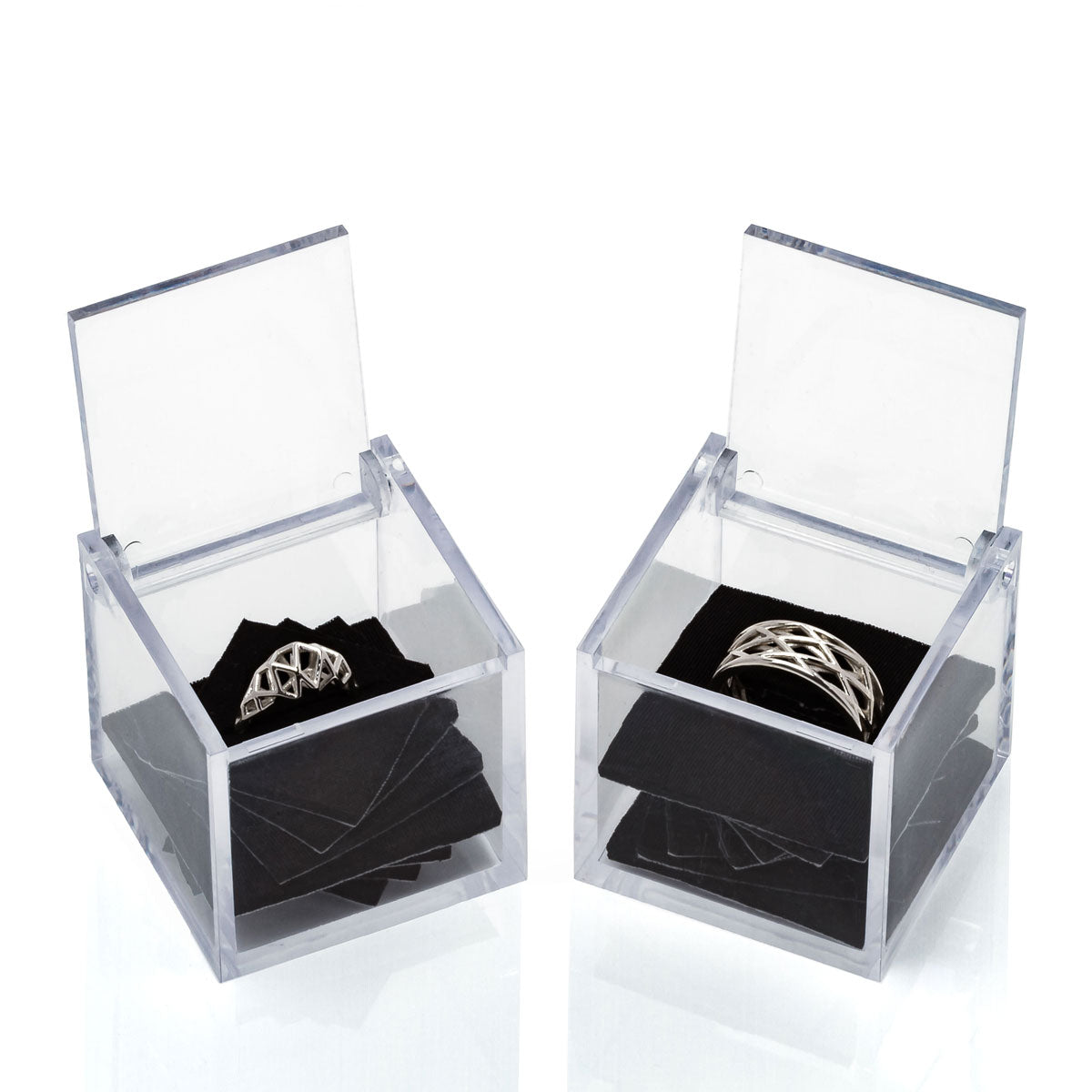 Wedding ring set sharing architectural geometry in different forms. One a masculine or unisex band of latticework. The other a modern interpretation of traditional Art Deco engagement rings. 