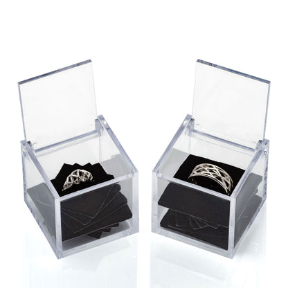 Wedding ring set sharing architectural geometry in different silhouettes. One is a modern interpretation of traditional Art Deco engagement rings. The other is a masculine or unisex band of latticework. 